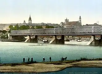 Kierbedź Bridge over the Vistula in Warsaw (c.&nbsp;1900). This framework bridge was constructed by Stanisław Kierbedź in 1850–1864. It was destroyed by the Germans in 1944.[50]