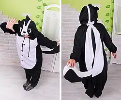 front and back views of person wearing a skunk onesie