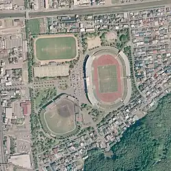 An aerial view of an athletic park with three sports fields