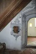 A passthrough next to the door in an ermitic monastery (Ittingen Charterhouse)