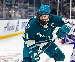 Hilary Knight skates on ice in hockey gear during Seattle Torrent's inaugural home game at Climate Pledge Arena, November 2025