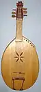 Veresai Bandura often referred to as a kobza - a Ukrainian Lute-like instrument, described by Mykola Lysenko from Ostap Veresay - Ukrainian blind epic singer approx. in 1871
