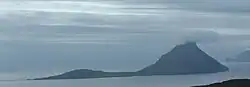 Koltur as seen from Streymoy, with the mountain of Kolturshamar centre right