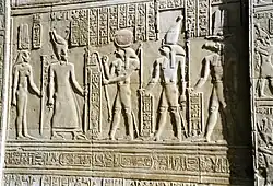Ptolemy VIII and his wife Cleopatra II facing the gods Re-Horkhty Horus and Sobek