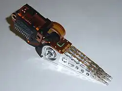 Head stack with an actuator coil on the left and read/write heads on the right