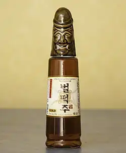Bottle whose cap is a smiling penis