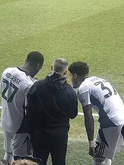 Ryan Giggs giving advice to Kylian Kouassi and Francis Okoronkwo during the ongoing AFC Wimbledon and Salford City match.