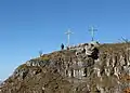 Two Christian crosses on the summit.