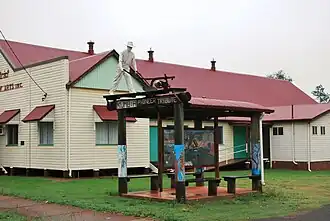 Kumbia Pioneer tribute beside the Memorial School of Arts hall