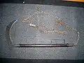 Japanese sickle weapon with a chain and iron weight attached "kusarigama"