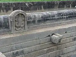 Nāga sculpture and stone spout in north pond[7]
