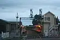 Westbound view from the Mollison Street level crossing looking at signal box, station buildings and platforms, June 2006