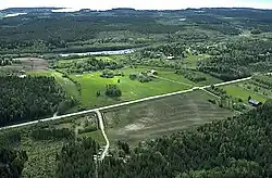 The E4 road passing through Lövsele, with the lake in the background