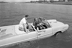 President Lyndon B. Johnson driving an Amphicar, 1965