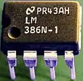 A plastic dual-in-line package containing an analog integrated circuit.This can be installed in a socket or directly soldered to a printed circuit board.