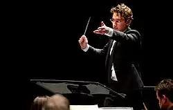 Abrams conducting the Louisville Orchestra on September 6, 2014