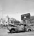 The burnt-out LaSalle 1940 Series 52 Sedan of the late Brigadier Mallaby on the spot where he was murdered by Indonesian nationalists in Surabaya (Soerabaja) on 31 October 1945.