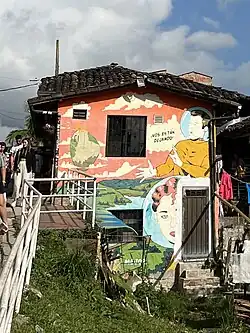 A mural in La Plazoleta that tells a story once believed by locals about where La Piedra came from.