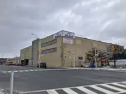 A photo of the Labatt Brewery in London, Ontario. It is cloudy in the background.
