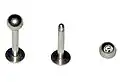 A labret stud is commonly used for piercings through the cheek, such as labret, madonna, monroe, and dimple piercings. It can also be used for other piercings, such as tragus or conchs. Shown with external screw threads.
