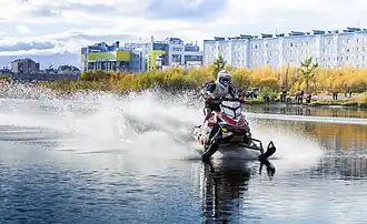Snowmobile racing on water