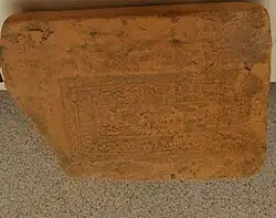 A brick found in Bhismaknagar Fort with the Chutia king Pratyaksh Narayan and Lakshminarayan's name inscribed in it.