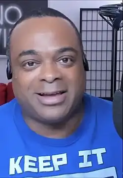 Wilson pictured January 2020 in a blue shirt on podcast
