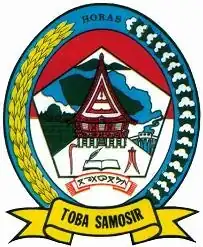 Former emblem of Toba Samosir Regency. The regency was renamed into Toba Regency as of 2020 which affects the use of the former Emblem.[45]