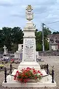 The war memorial is behind the church in the cemetery.
