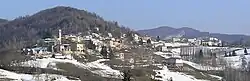 The buildings and trees that make up Perlo