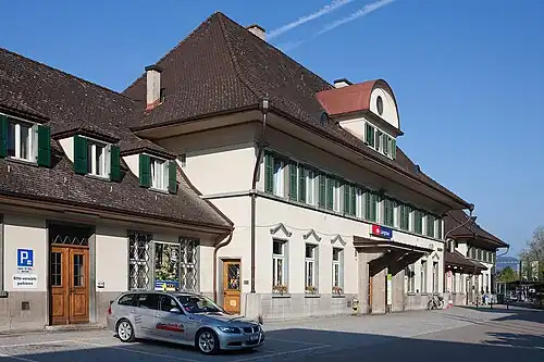 Three-story building with gabled roof