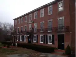 The Company Store, now known as the Larkin Building, on the edge of Linwood, at Whitin St. and East Hartford Ave. The Company Store is a part of the Rogerson Village Historic District.