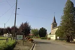 The church and surroundings in Le Mesnil-Véneron
