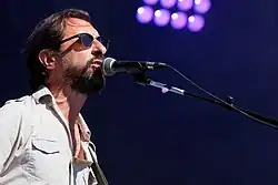 J. P. Nataf performing with Les Innocents on the stage of the Festival du bout du monde&nbsp;[fr] in August 2016