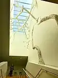 Main staircase with tree sculpture