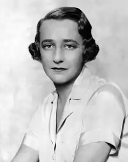 head and shoulders shot of a youngish white woman with medium-length dark hair