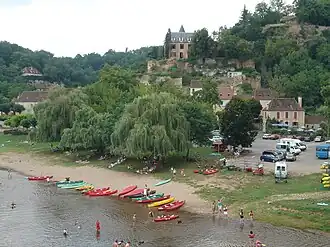 Canoes on the bank of the Dordogne river in Limeuil