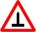Spiked tires sign required on the rear of vehicles with studs in Lithuania.