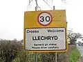 Bilingual English-Welsh sign with speed limit, Llechryd