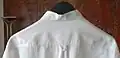 A loop on the outside of a shirt (so-called "locker loop")