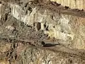Zooming in further, one can see that the object is an abandoned steam locomotive. (Click through for a larger image.)
