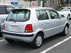 Back of a five-door car with a boot spoiler