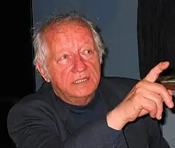 Photo of Lojze Lebič. He appears to be discussing something and is mid-gesture