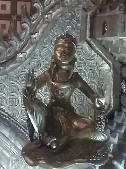 A Lokanat image symbolising peace, at the left side of the throne.
