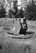 A Belgian M1891 turret at Fort Loncin. An explosion in the ammunition bunker threw the turret into the air and it landed upside down in its own pit largely intact.