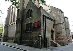 St Michael's Woolwich, west front, by Caroe (to designs by William Butterfield), 1898-1899