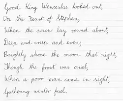 The first verse of "Good King Wenceslas" in cursive