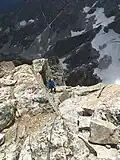 Lowe climbing the famous V Pitch on the Upper Exum Ridge of the Grand Teton in August 2019 for his 75th birthday.