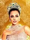 The fourth edition of the golden crown, as worn by Miss Grand International 2023, Luciana Fuster