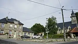 The town hall and church in Méry-Prémecy